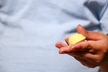 children's hands are making multicolored small pelmeni for festive feast.