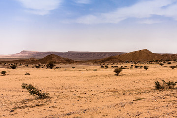 A desert landscape south-west of Riyadh; A combination of plain and rocky hill terrain typical for Riyadh Province