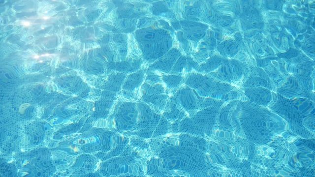 Inspiring turquoise waters in a swimming pond in Alanya resort in summer in slo-mo  