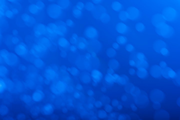Abstract blue bokeh background.