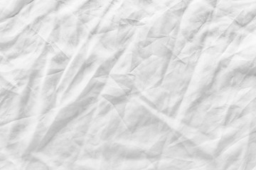 Fototapeta na wymiar White fabric texture background. Wrinkled, crumpled fabric.