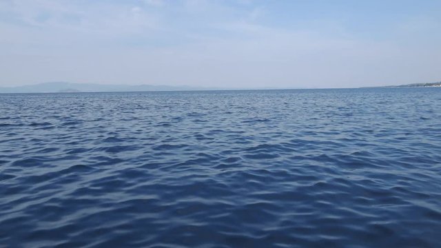 Sunny day on the sea water POV