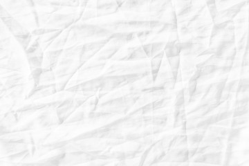 White fabric texture background. Wrinkled, crumpled fabric.