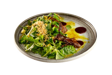 Plate of salad with duck breast served with hoisin sauce isolated at white background.