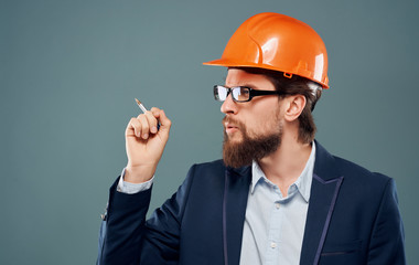 engineer with helmet and blueprint