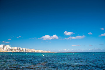 Beautiful blue Mediterranean beach and landscape. Holiday resort photo - obrazy, fototapety, plakaty