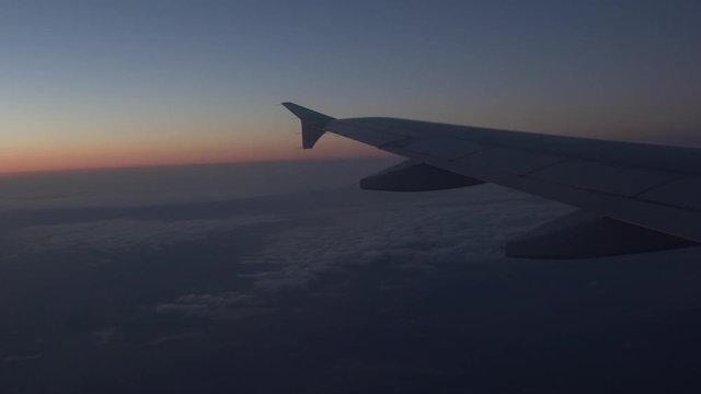 Wing of a airplane in the sunset
