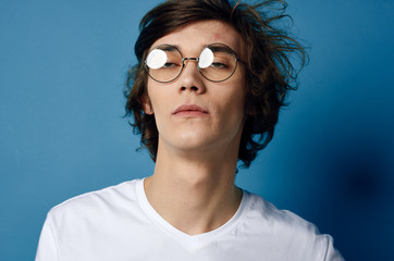 portrait of young man in glasses