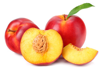 Nectarine with green leaf and slices isolated on white background