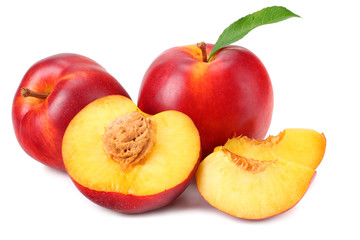 Nectarine with green leaf and slices isolated on white background