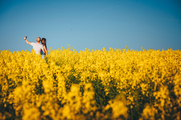 Selfie in yellow spring field