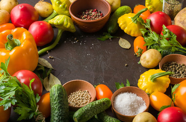 Fresh summer vegetables on the kitchen table. Lay out in the form of a frame for placement inside the text, recipe or photo.