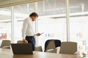 Businessman using mobile phone in the conference room