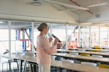 Female executive practicing her speech in the conference room