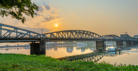 Dawn at Trang Tien Bridge. This is a Gothic architectural bridge spanning the Perfume river from the 18th century designed by Gustave Eiffel in Hue, Vietnam