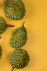 durian on bright yellow background with copyspace