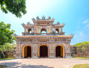 Colorful imperial city gate. This is lead into the forbidden city where the feudal king work Imperial Royal was in the 19th century in Hue, Vietnam