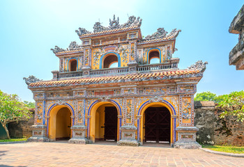 Fototapeta na wymiar Colorful imperial city gate. This is lead into the forbidden city where the feudal king work Imperial Royal was in the 19th century in Hue, Vietnam
