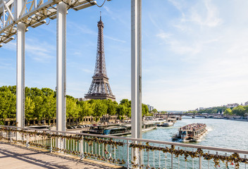 The Eiffel tower in Paris, France, seen from the Debilly footbridge on a sunny summer afternoon...