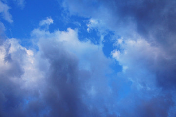 White and blue contrasting blue clouds in the sky.