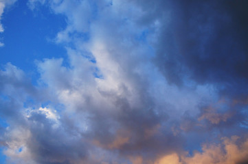 White and blue contrasting blue clouds in the sky.