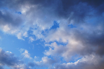 White and blue contrasting blue clouds in the sky.
