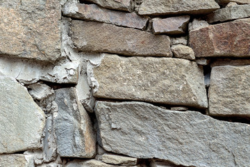 Gray stone wall weathered old vintage texture background pattern