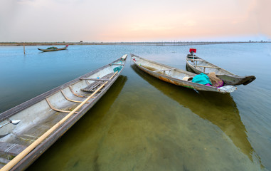 Obraz premium Wooden boat dock in Chuon lagoon, Hue, Vietnam. This is a living means of transportation in the flooded area in central Vietnam