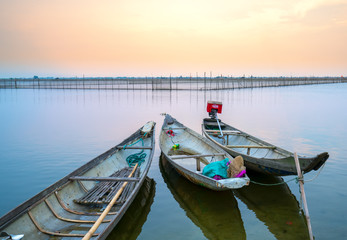 Obraz premium Wooden boat dock in Chuon lagoon, Hue, Vietnam. This is a living means of transportation in the flooded area in central Vietnam