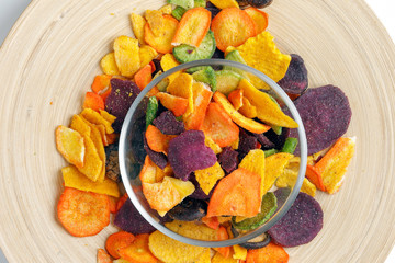 Healthy vegetable chips yellow sweet potato purple sweet potato carrot green radish green beans and shiitake mushrooms
