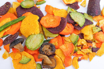 Healthy vegetable chips yellow sweet potato purple sweet potato carrot green radish green beans and shiitake mushrooms