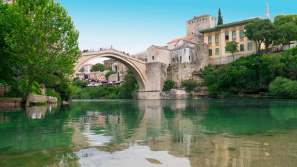 Old town of Mostar and Stari Most bridge above beautiful emerald river Neretva. - April 2019, Mostar, Bosnia and Herzegovina.