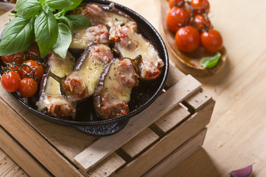 Baked eggplant stuffed with mozzarella cheese and tomatoes