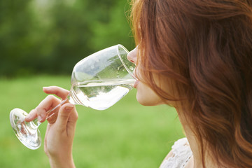 woman drinking water from bottle