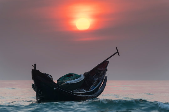 Fishing boats of fishermen at sea before dawn welcoming a new day