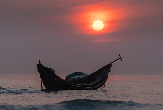 Fishing boats of fishermen at sea before dawn welcoming a new day