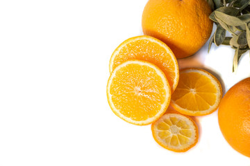 Sliced orange with green leaf isolated on white background