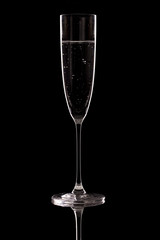 Glass of champagne on a black background