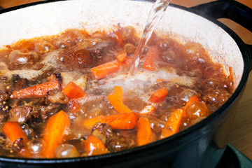 Cooking of traditional Uzbek pilaf