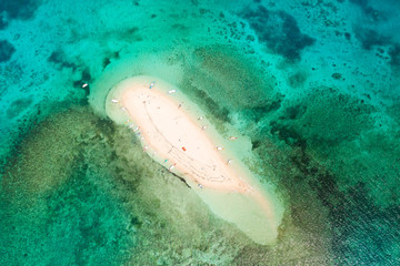 Naked Island, Siargao. The white sandy island is surrounded by a coral reef, a top view. Philippine nature.