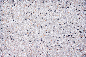 Multicolored  terrazzo small rock seamless hamper patterns on wall abstract texture for background