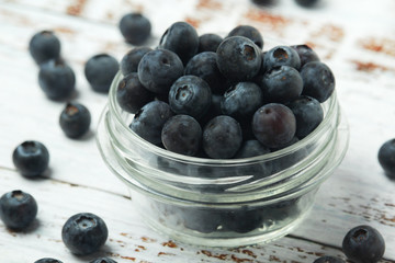 A glass bowl with blueberry