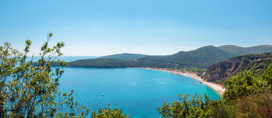 Fototapeta na wymiar Panoramic view from above to the Adriatic sea coastline and Jaz beach near a Budva city, Montenegro