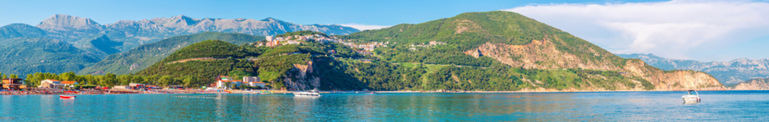 Fototapeta na wymiar Summer seascape, Adriatic sea coastline with Jaz beach surrounded by mountains, Montenegro. Super wide panoramic view