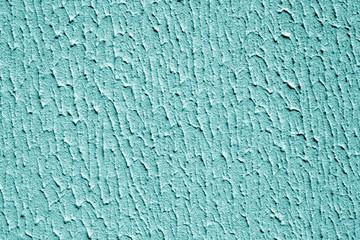 Plaster wall texture with interesting pattern in cyan color.