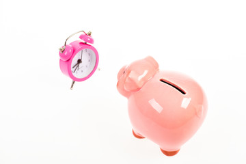 wealth time. retirement. family budget. business startup. financial position. success in finance and commerce. piggy bank with alarm clock. Moneybox. time is money. Economy and budget increase