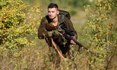 Hunting is brutal masculine hobby. Bearded serious hunter spend leisure hunting. Hunter hold rifle....