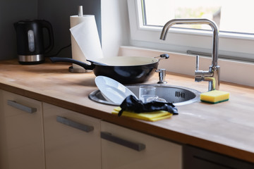 Dirty dishes lying in the sink.