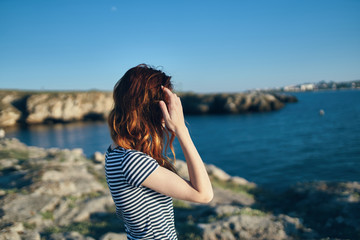 young woman looking at the sea