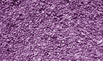 Fototapeta premium Pile of small gravel stones in purple tone.